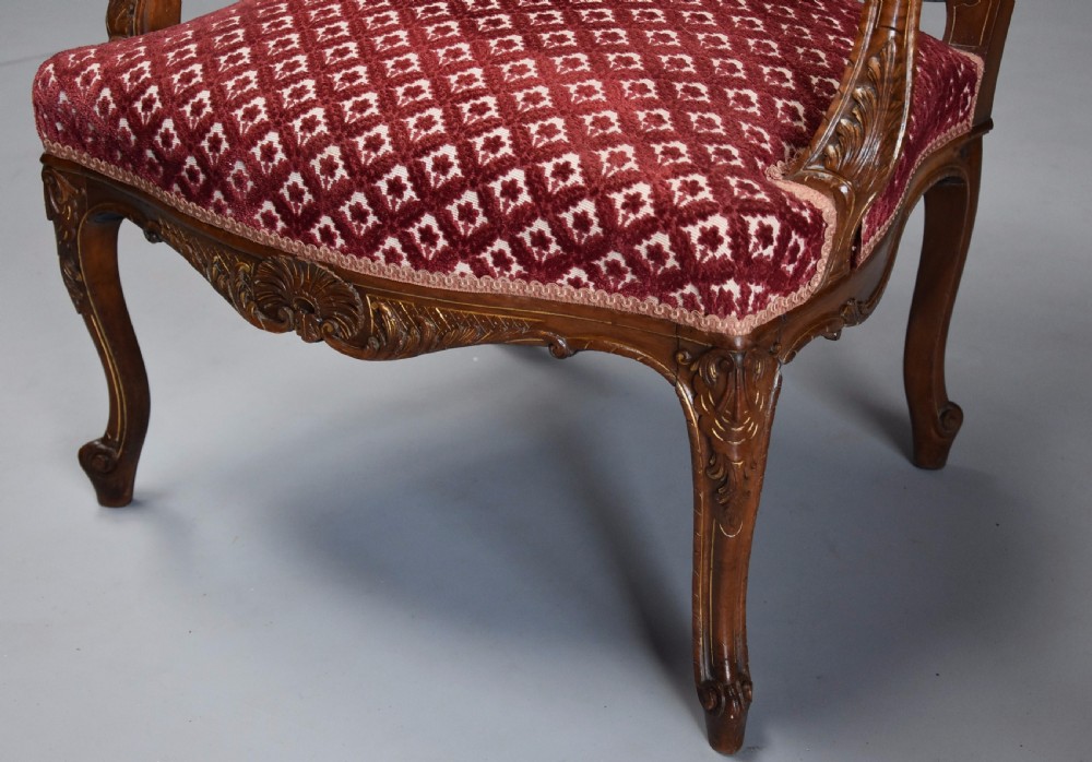 Pair of late 19thc French walnut fauteuils in the Louis XV style with traces of original gilt View XI