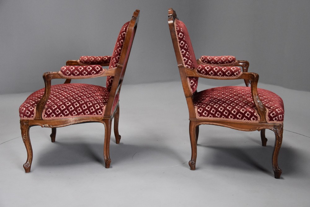 Pair of late 19thc French walnut fauteuils in the Louis XV style with traces of original gilt View XII