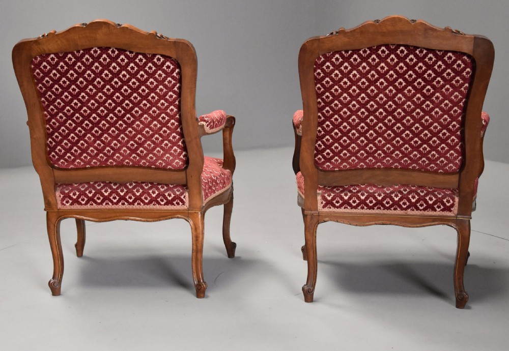 Pair of late 19thc French walnut fauteuils in the Louis XV style with traces of original gilt View XIII
