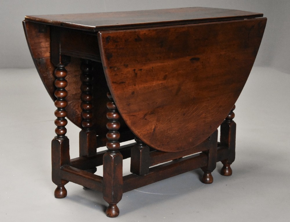 17th century oval oak gateleg table with single gate & bobbin turned legs and super patina