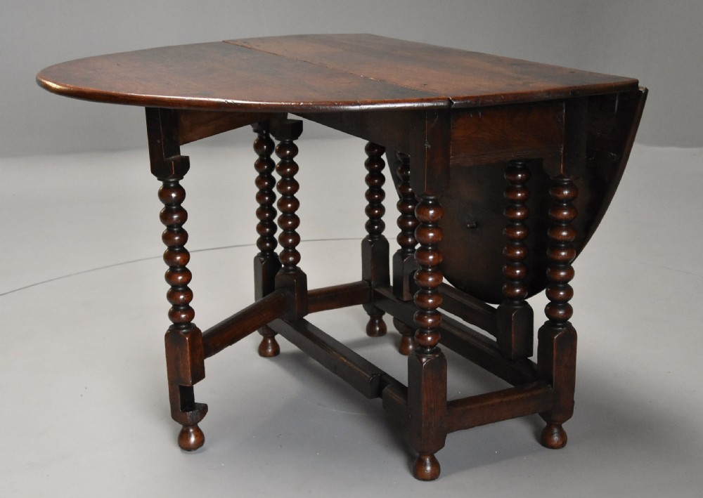 17th century oval oak gateleg table with single gate & bobbin turned legs and super patina View III