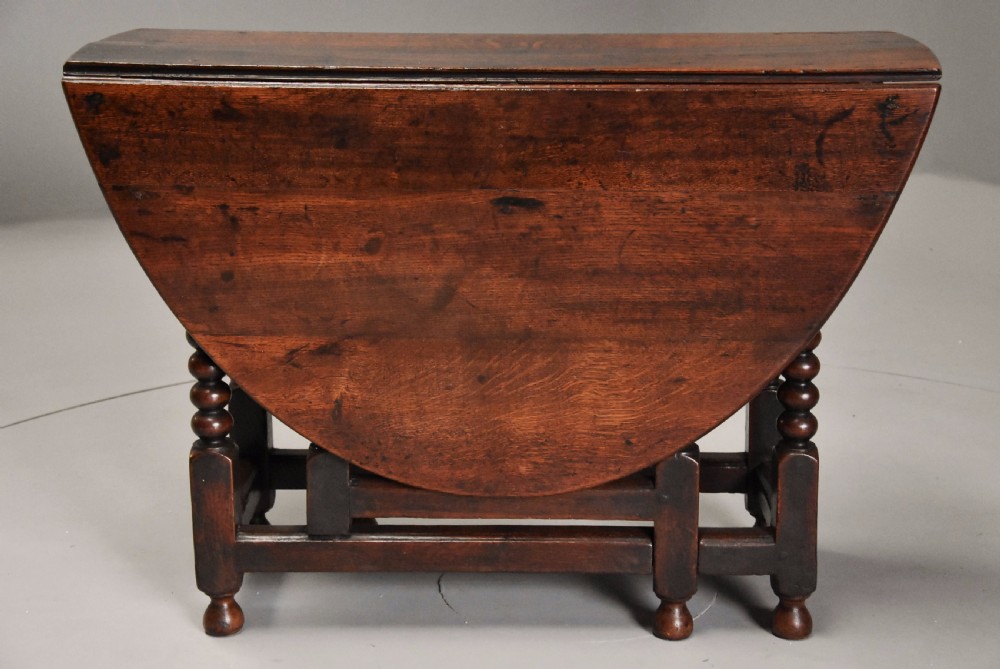 17th century oval oak gateleg table with single gate & bobbin turned legs and super patina View V