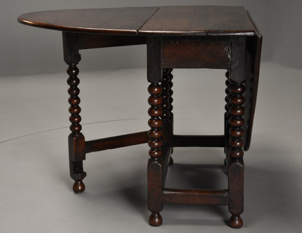 17th century oval oak gateleg table with single gate & bobbin turned legs and super patina View XI