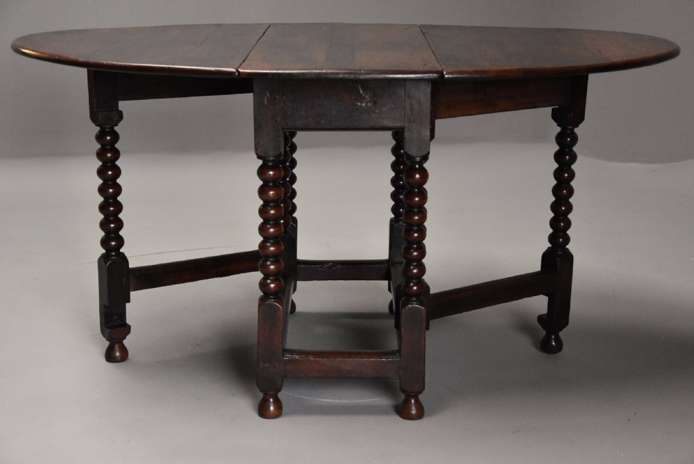 17th century oval oak gateleg table with single gate & bobbin turned legs and super patina View XII