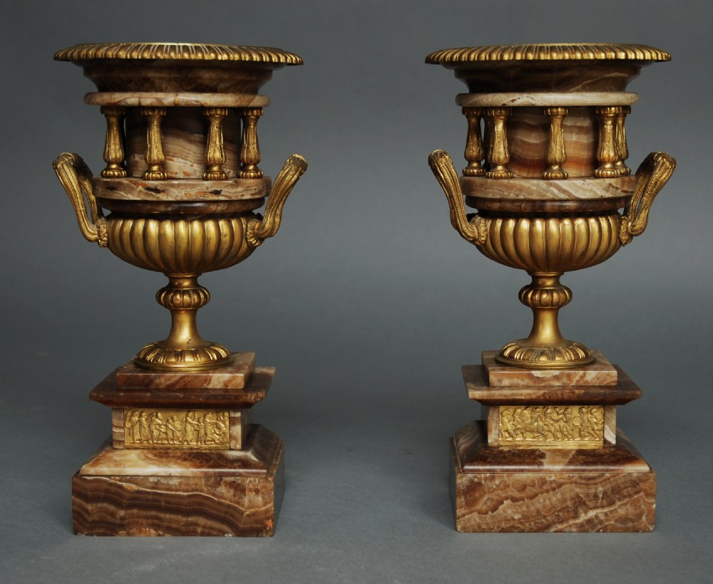 Pair of French late 19thc fine quality onyx urns with ormolu mounts in the Classical style
