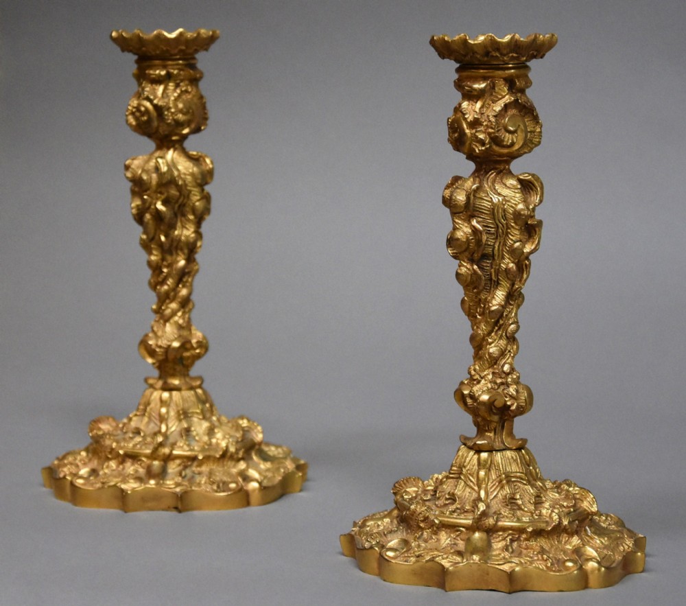 Pair of late 19th century French highly decorative ormolu candlesticks in the Rococo style