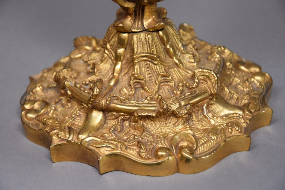 Pair of late 19th century French highly decorative ormolu candlesticks in the Rococo style View VII