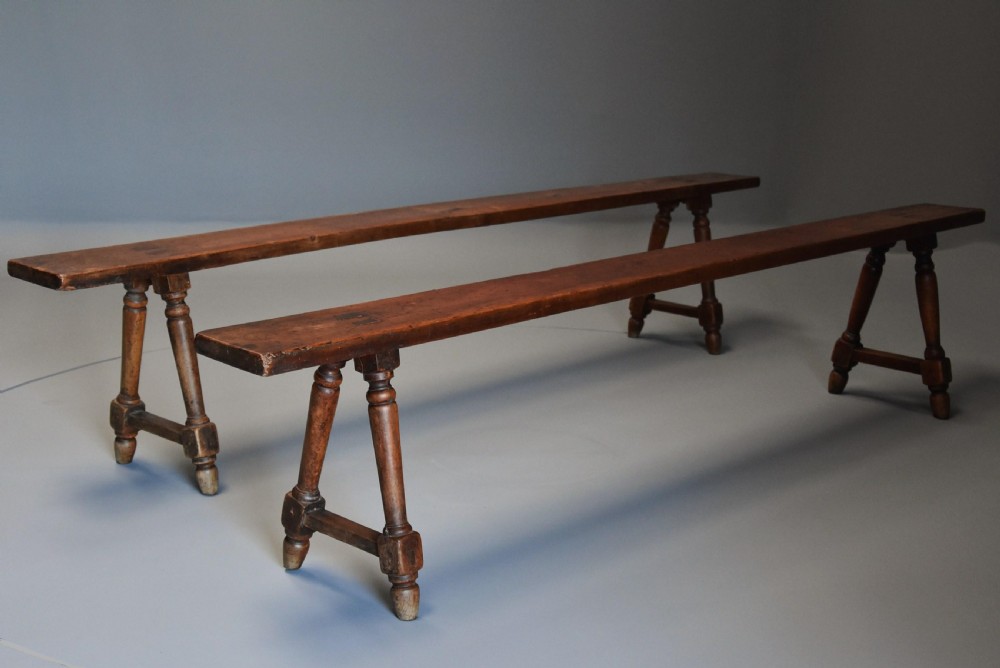 Pair of mid 19th century French fruitwood (cherry) benches of superb patina