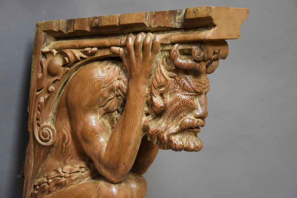 Large highly decorative superbly carved Continental pine bracket in the form of a satyr View III