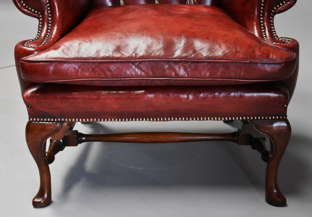 Superb pair of early 20th century Georgian style deep buttoned red leather wing armchairs View X