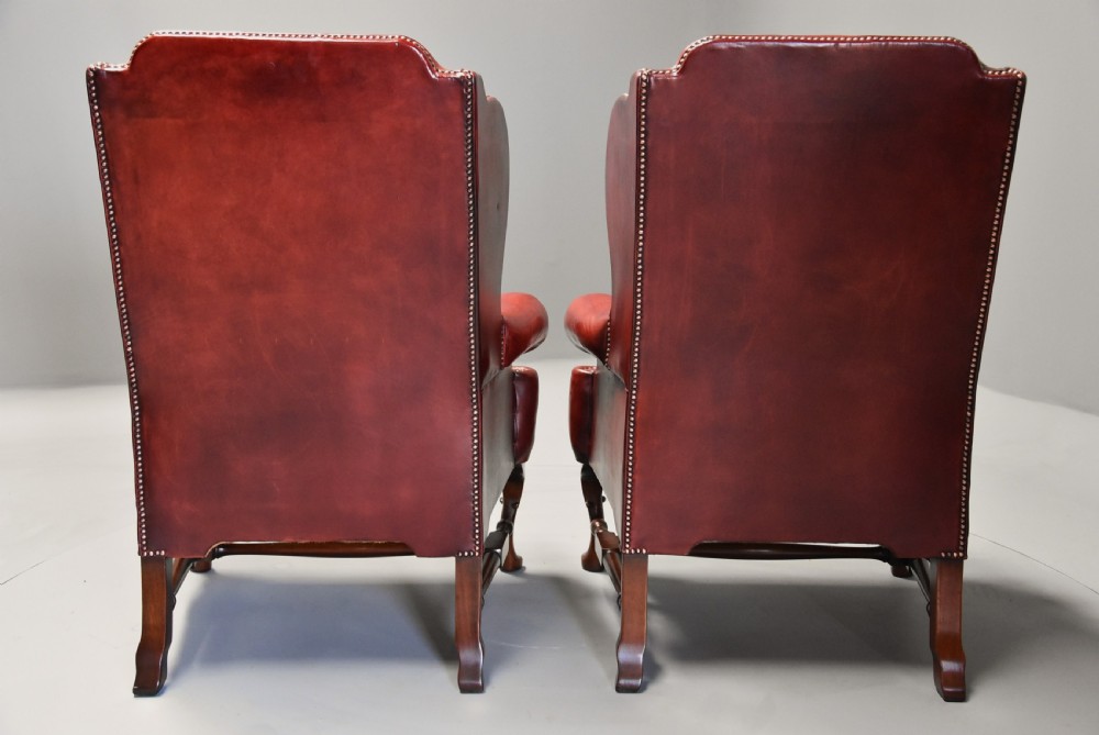 Superb pair of early 20th century Georgian style deep buttoned red leather wing armchairs View XIII
