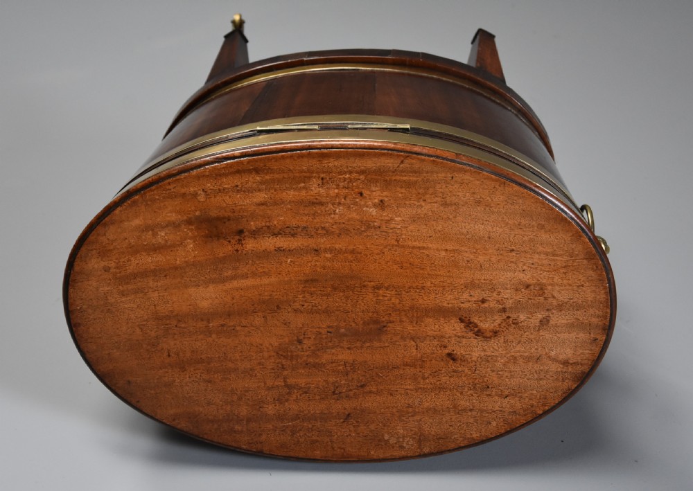 Late 18th century mahogany & brass bound oval cellaret of slender proportion View V