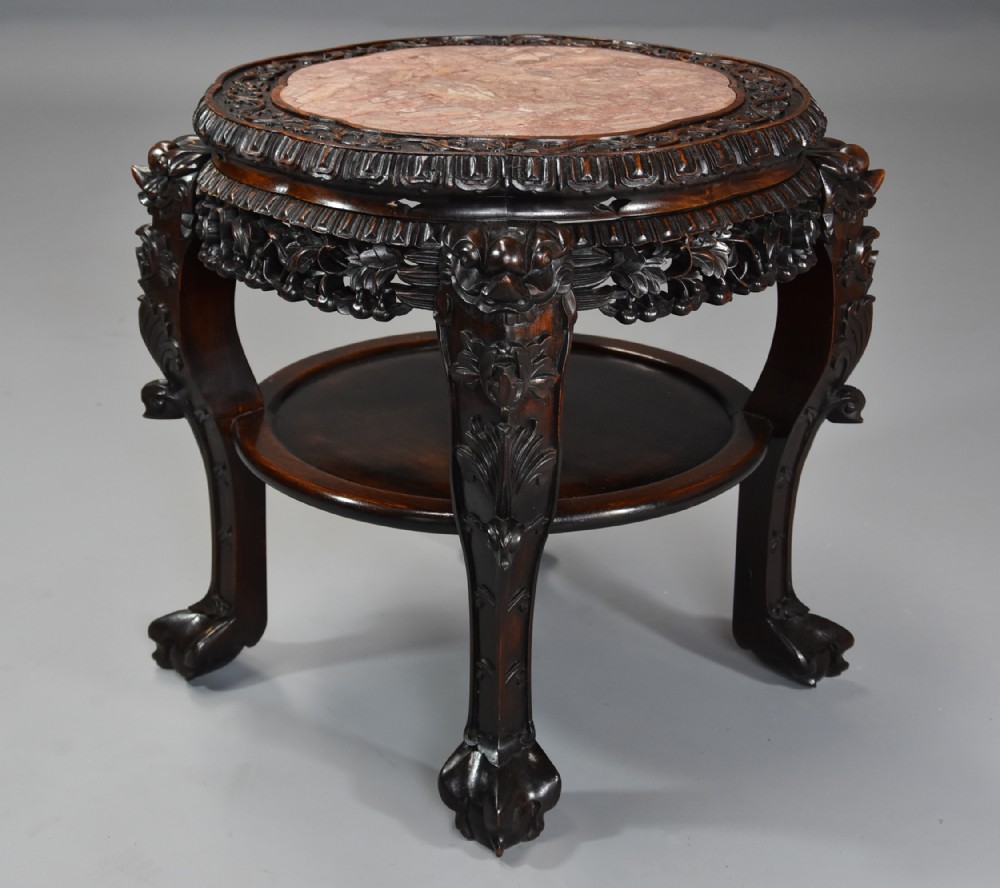 Late 19th century Chinese hardwood circular pot stand or low table 