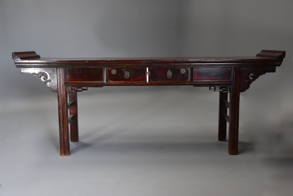Late 19thc Chinese elm two drawer side table of large proportions View II