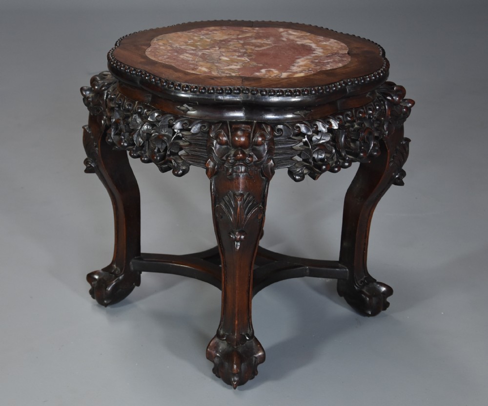 Late 19th century Chinese hardwood pot stand with shaped marble inset top