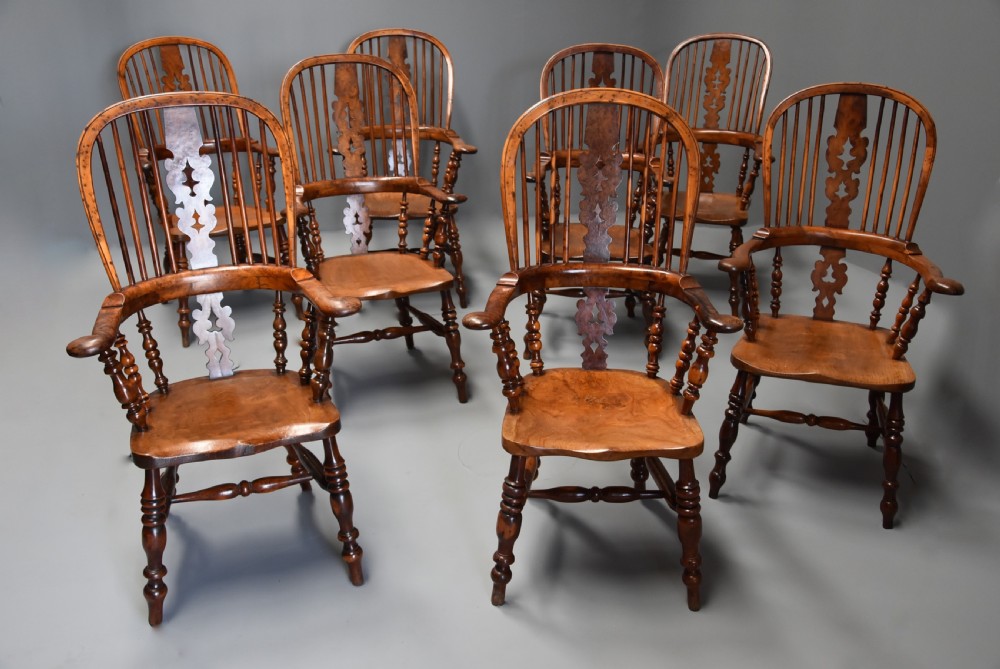 Superb rare set of eight 19th century burr yew broad arm high back Windsor armchairs of superb patina