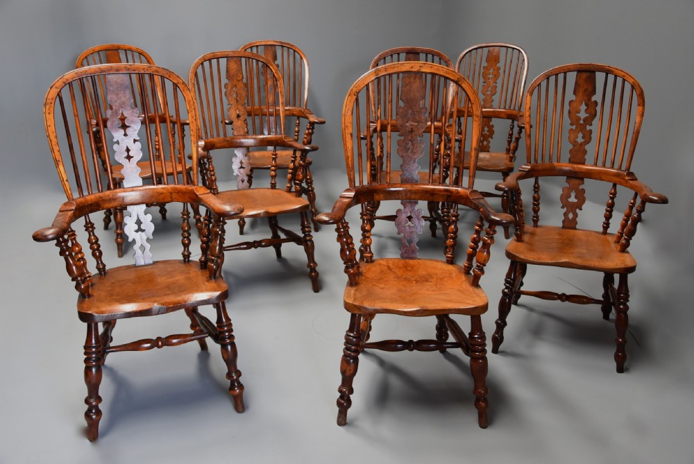 Superb rare set of eight 19th century burr yew broad arm high back Windsor armchairs of superb patina View II