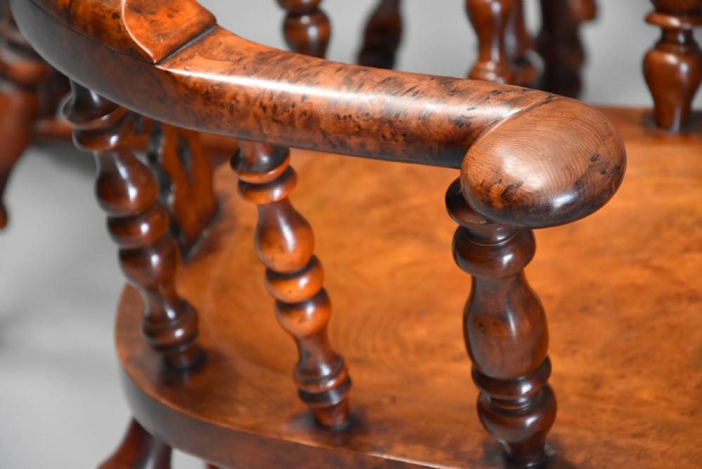 Superb rare set of eight 19th century burr yew broad arm high back Windsor armchairs of superb patina View X
