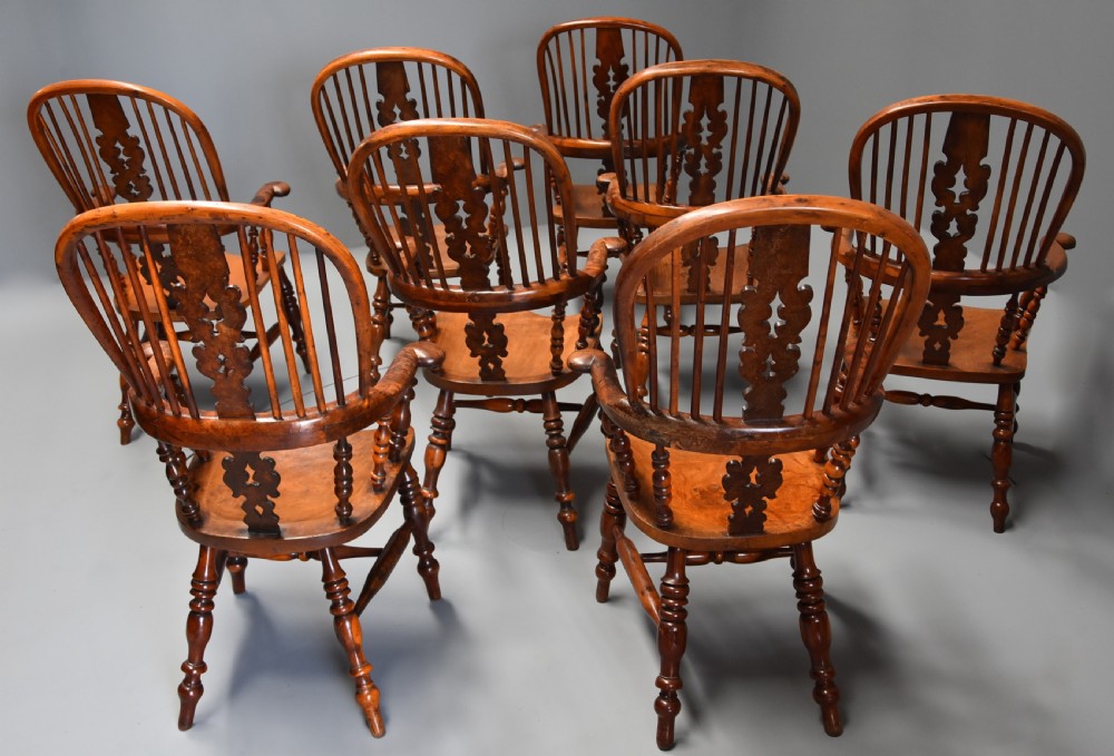 Superb rare set of eight 19th century burr yew broad arm high back Windsor armchairs of superb patina View XII