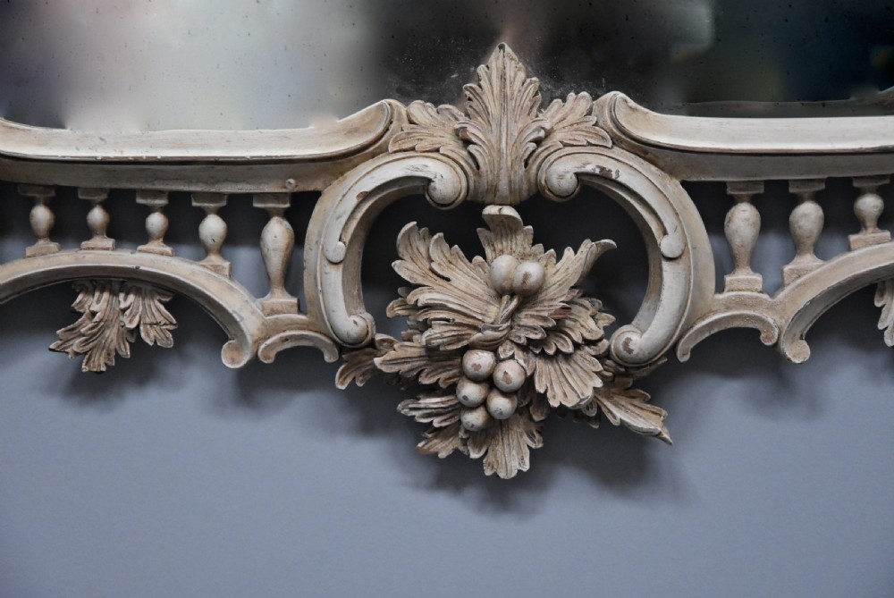 A pair of highly decorative Chippendale style painted carved wooden pier mirrors View VIII