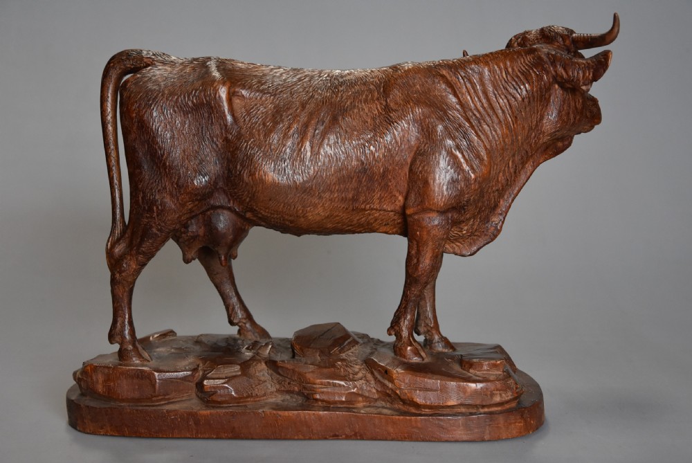 Finely carved late 19thc linden wood Black Forest cow, possibly by The Huggler family View IX