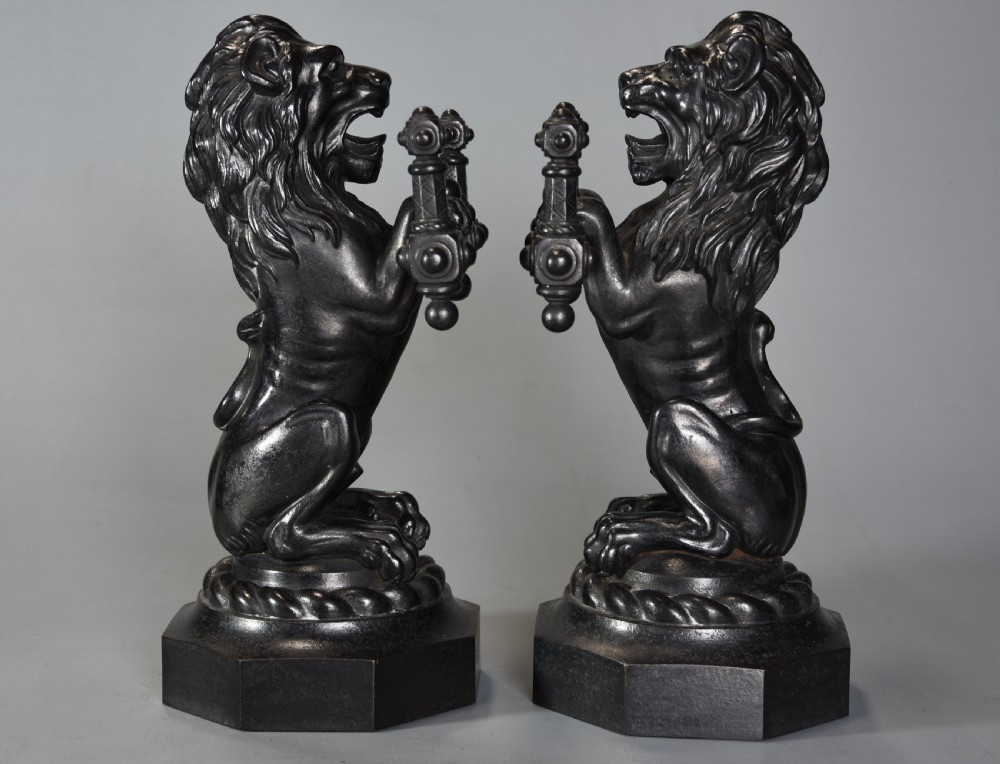 Pair of fine quality late 19th century cast iron fire dogs in the form of lions