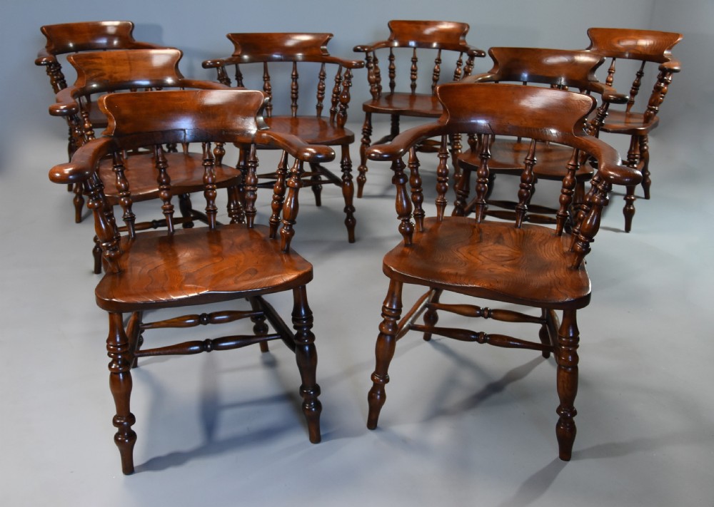 Large set of eight mid 19th century Smokers bow Windsor chairs or office chairs. View II