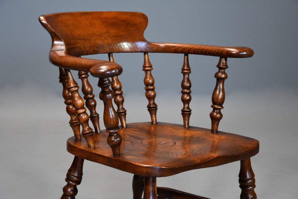 Large set of eight mid 19th century Smokers bow Windsor chairs or office chairs. View VII