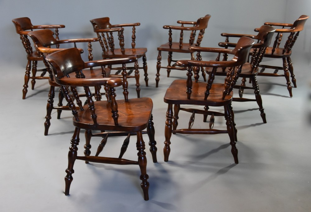 Large set of eight mid 19th century Smokers bow Windsor chairs or office chairs. View VIII
