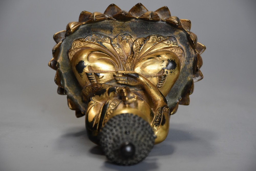 Superb quality gilt bronze Tibetan Buddha seated within a lotus flower base View XI