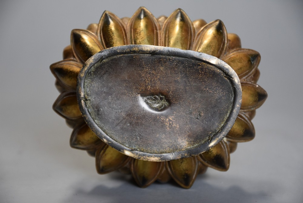 Superb quality gilt bronze Tibetan Buddha seated within a lotus flower base View XII