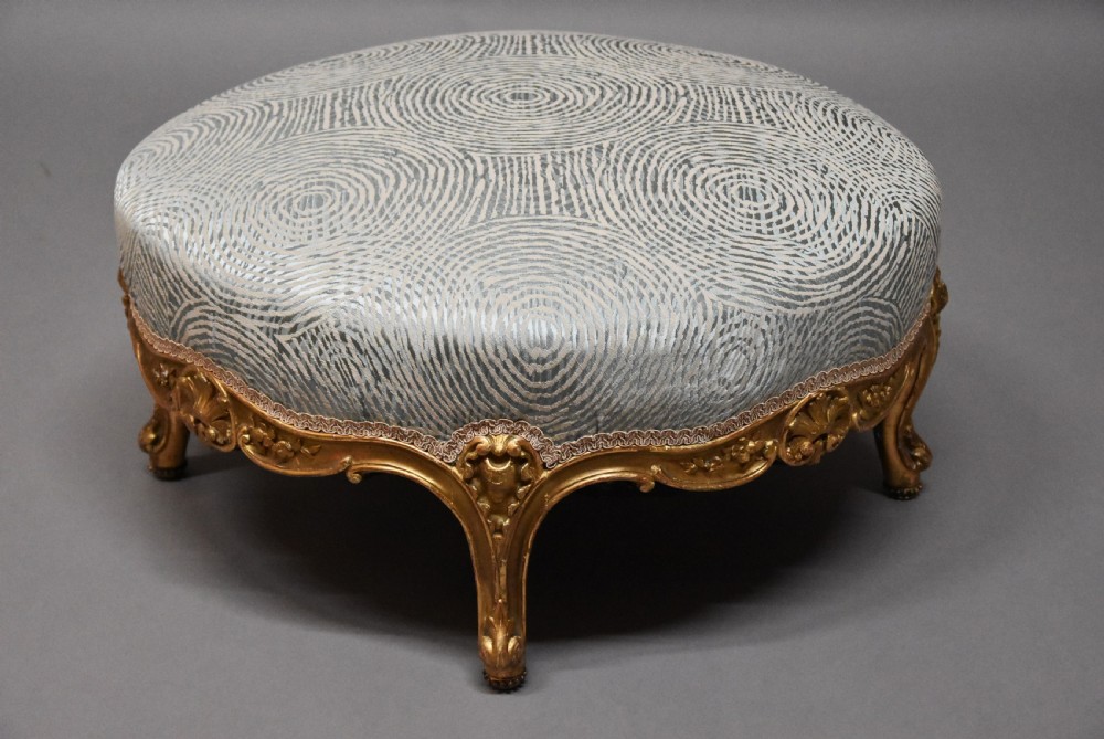Large highly decorative 19th century French circular giltwood footstool in the Rococo style View VI
