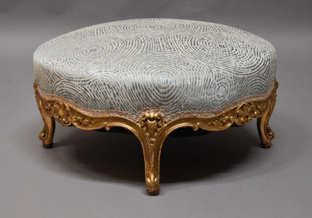 Large highly decorative 19th century French circular giltwood footstool in the Rococo style View VII