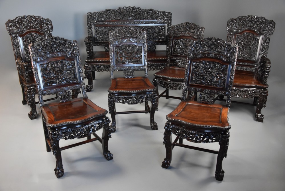 Superb quality late 19th century Chinese profusely carved padouk seven piece suite View III