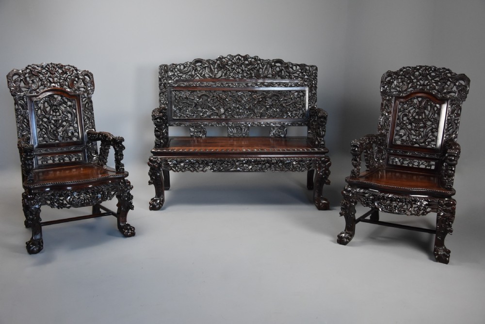 Superb quality late 19th century Chinese profusely carved padouk seven piece suite View IV