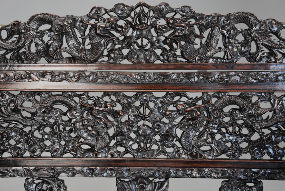 Superb quality late 19th century Chinese profusely carved padouk seven piece suite View VII