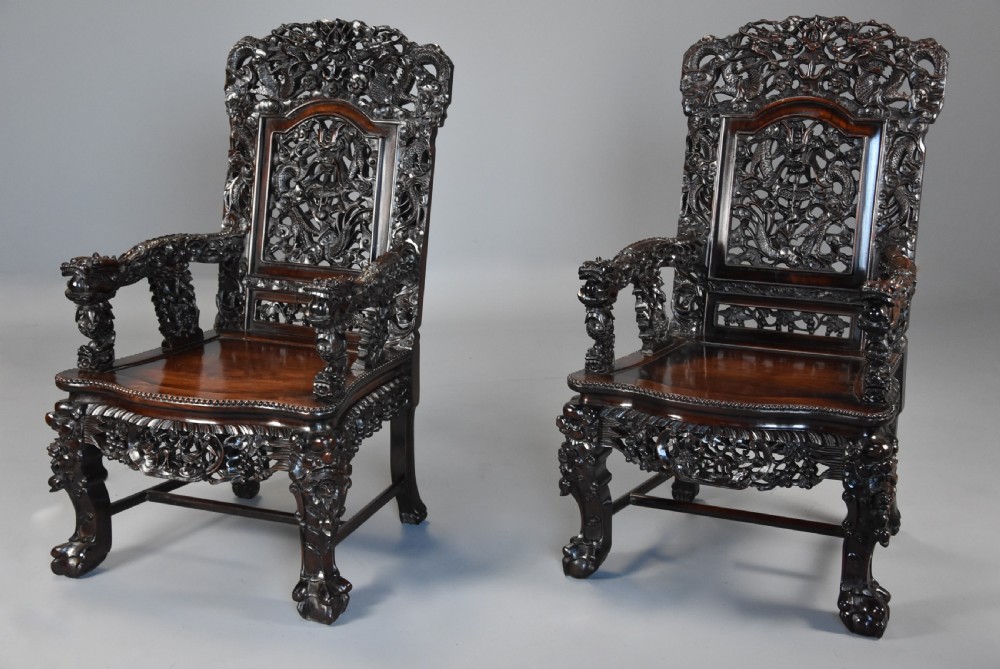 Superb quality late 19th century Chinese profusely carved padouk seven piece suite View IX