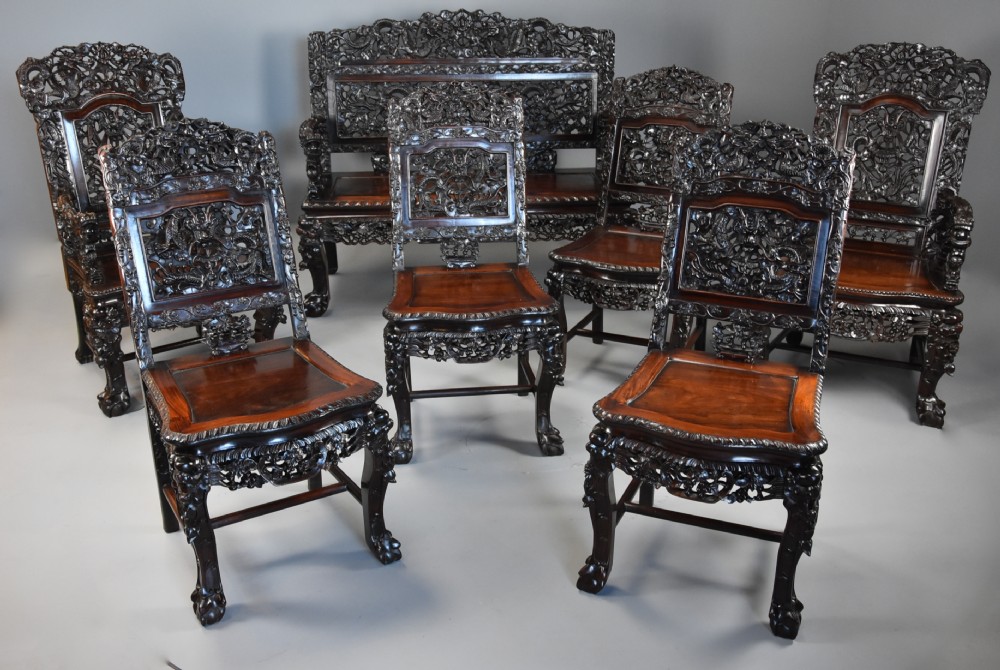 Superb quality late 19th century Chinese profusely carved padouk seven piece suite