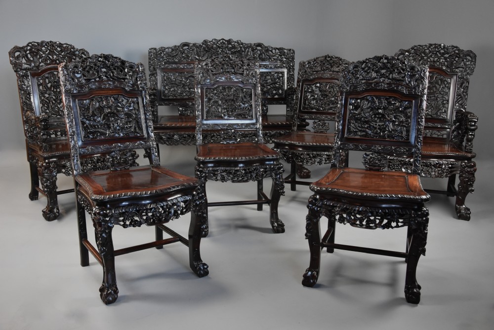 Superb quality late 19th century Chinese profusely carved padouk seven piece suite View II