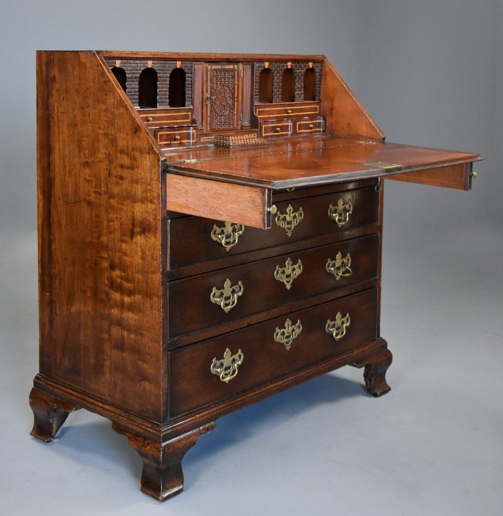 Mid-late 18thc mahogany bureau supported on ogee feet of fine patina with superb interior View V