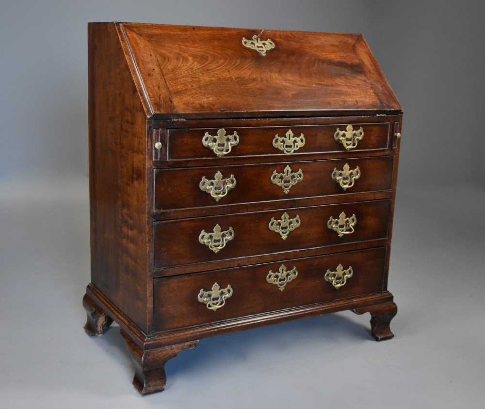 Mid-late 18thc mahogany bureau supported on ogee feet of fine patina with superb interior View VI