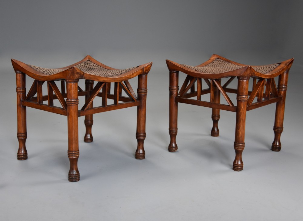 Pair of early 20th century walnut Thebes stools, designed by Liberty & Co. View III