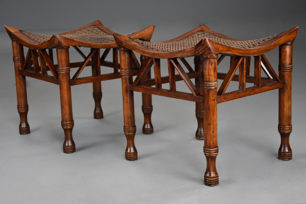 Pair of early 20th century walnut Thebes stools, designed by Liberty & Co. View VI
