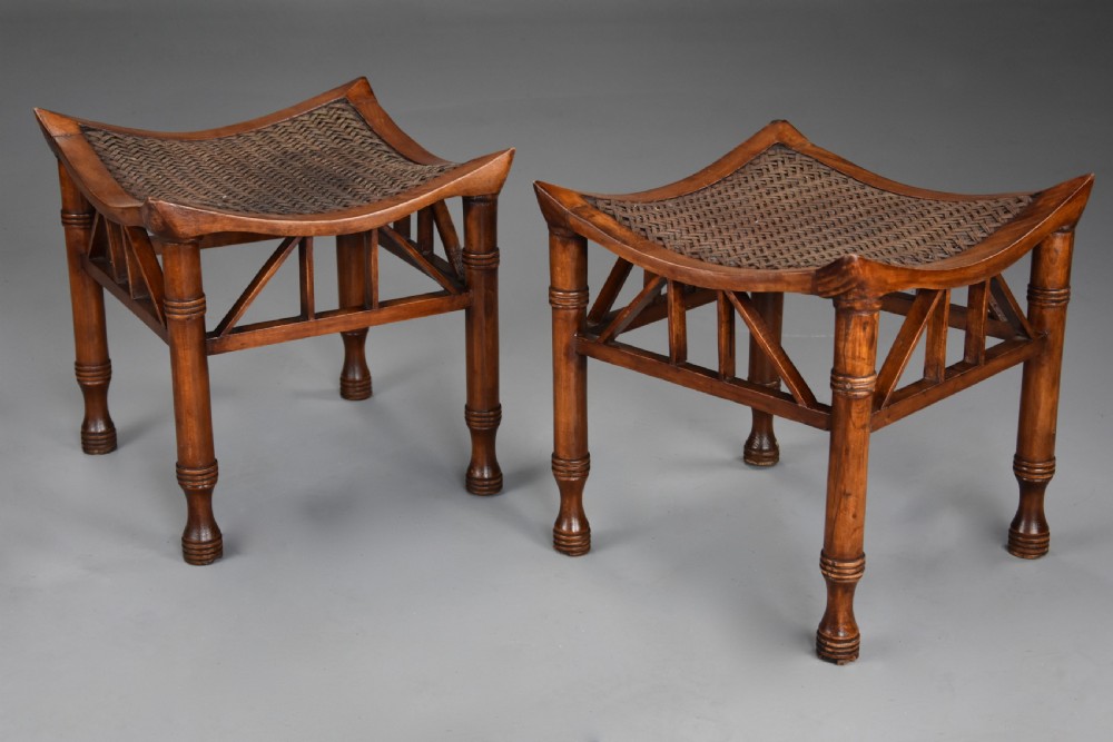 Pair of early 20th century walnut Thebes stools, designed by Liberty & Co. View VII