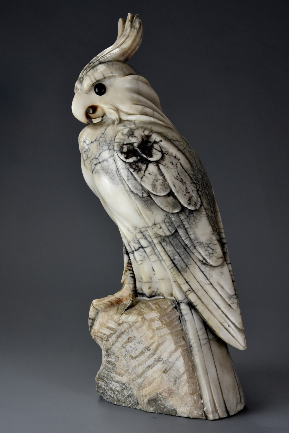 French Art Deco carved marble sculpture of a crested cockatoo