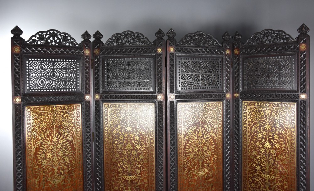 Fine quality 19thc Anglo Indian profusely carved padouk & brass inlaid four fold screen from Northern India View V
