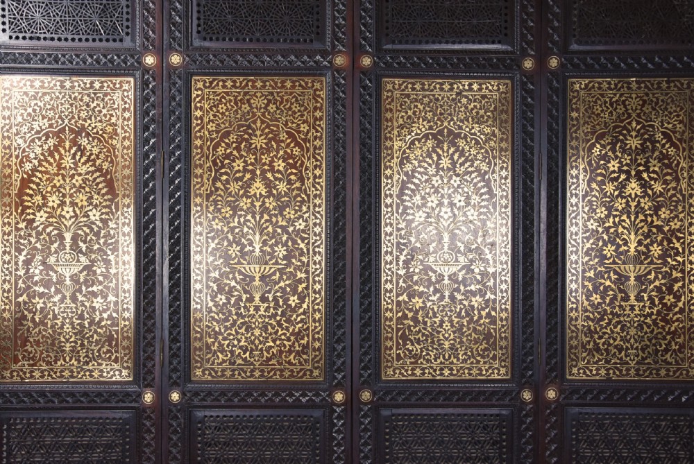 Fine quality 19thc Anglo Indian profusely carved padouk & brass inlaid four fold screen from Northern India View VI