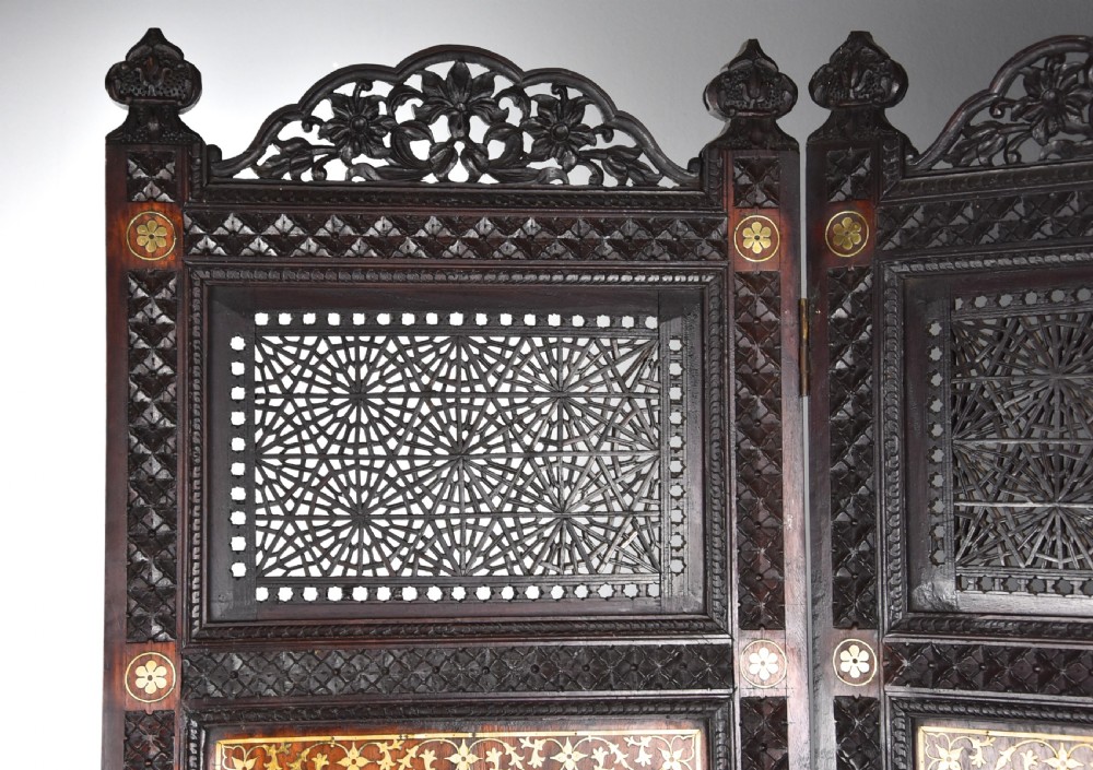 Fine quality 19thc Anglo Indian profusely carved padouk & brass inlaid four fold screen from Northern India View XIII