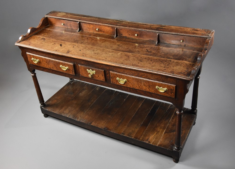 Mid 18th century oak potboard dresser base of superb patina View II