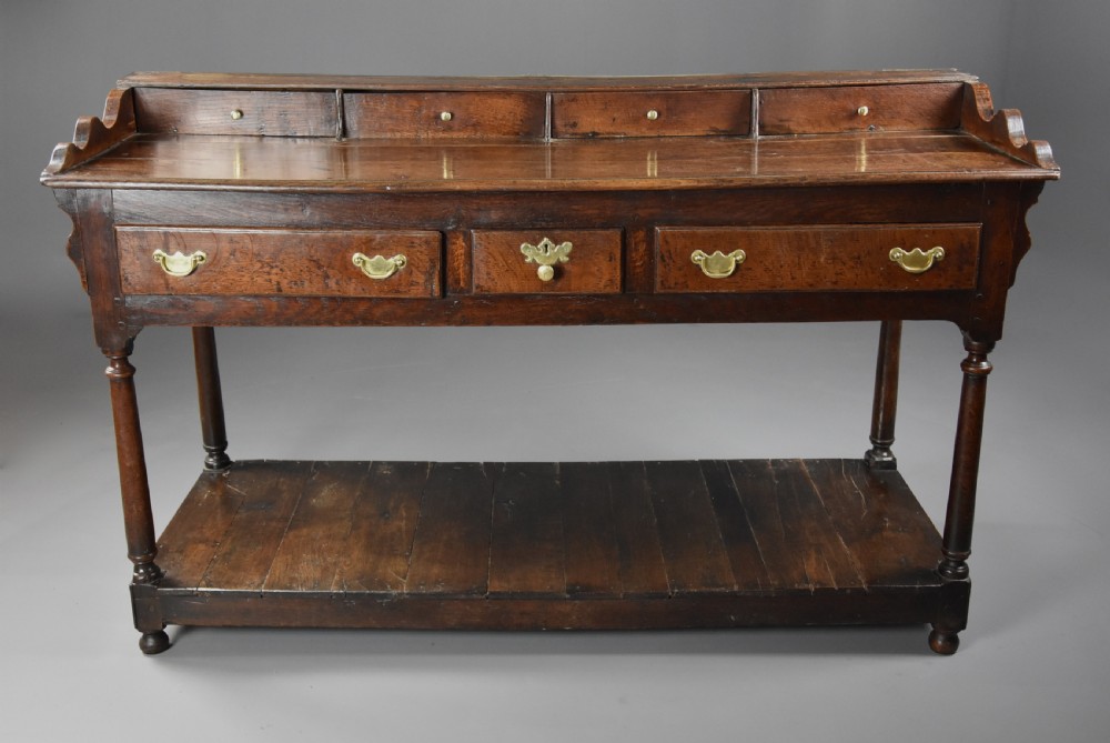 Mid 18th century oak potboard dresser base of superb patina View III